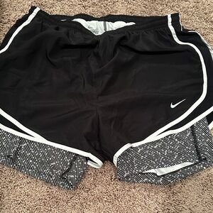 Woman’s large layered NIKE shorts new without tags. Super cute.